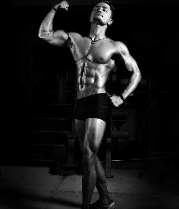 Man performing a controlled bodyweight exercise with intense focus.